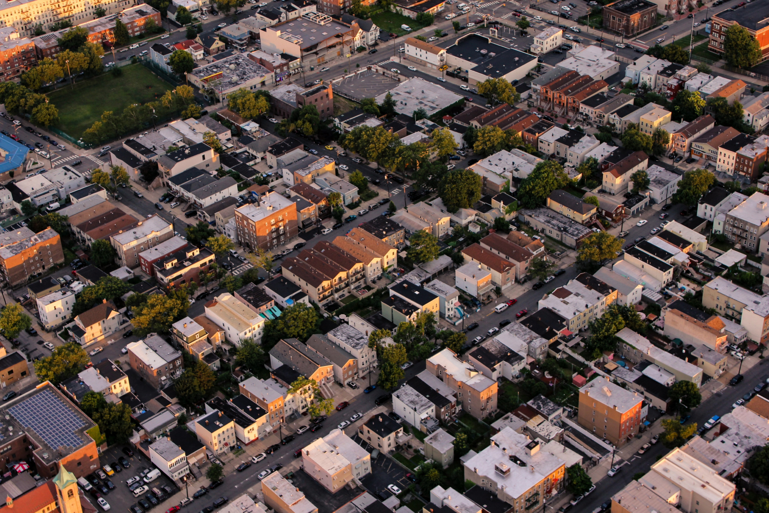 Aerial imagery of a community of homes and apartment buildings.